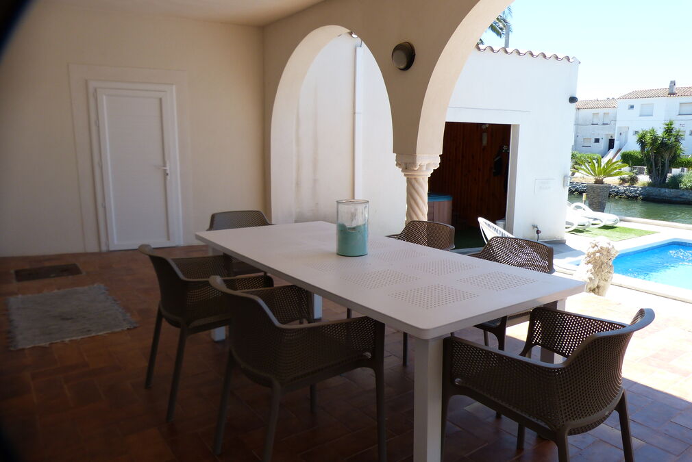 Beautiful house located on the corner of the wide canal of Empuriabrava with mooring.